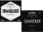 Lucky Man (incl. 80pg Photobook, 32pf DIY Book , Sticker, Photocard, Folded Poster, Magnetic Coupon, 4pc Sticker Set, 4pc Postcard Set + Lenticular Photocard) [Import] , Bobby